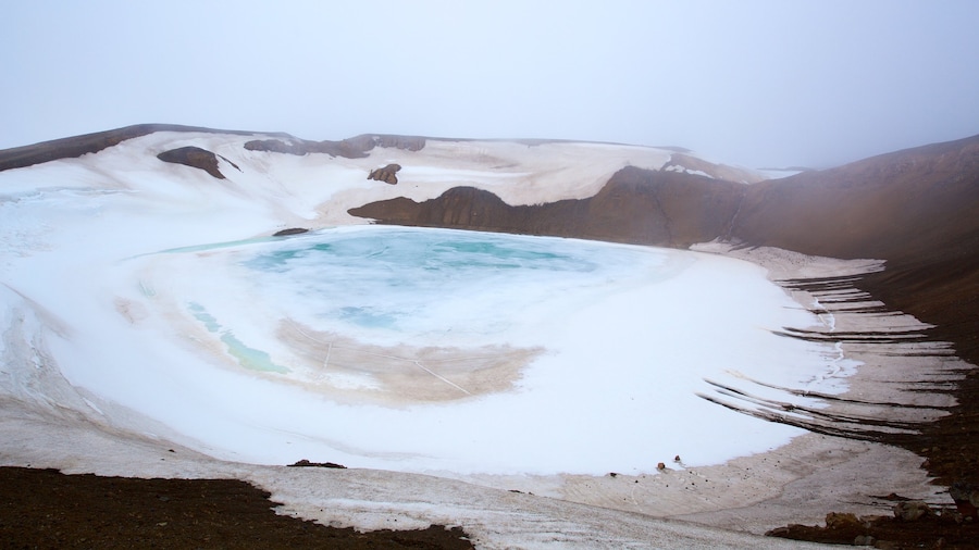 Krafla Volcano showing a hot spring and snow