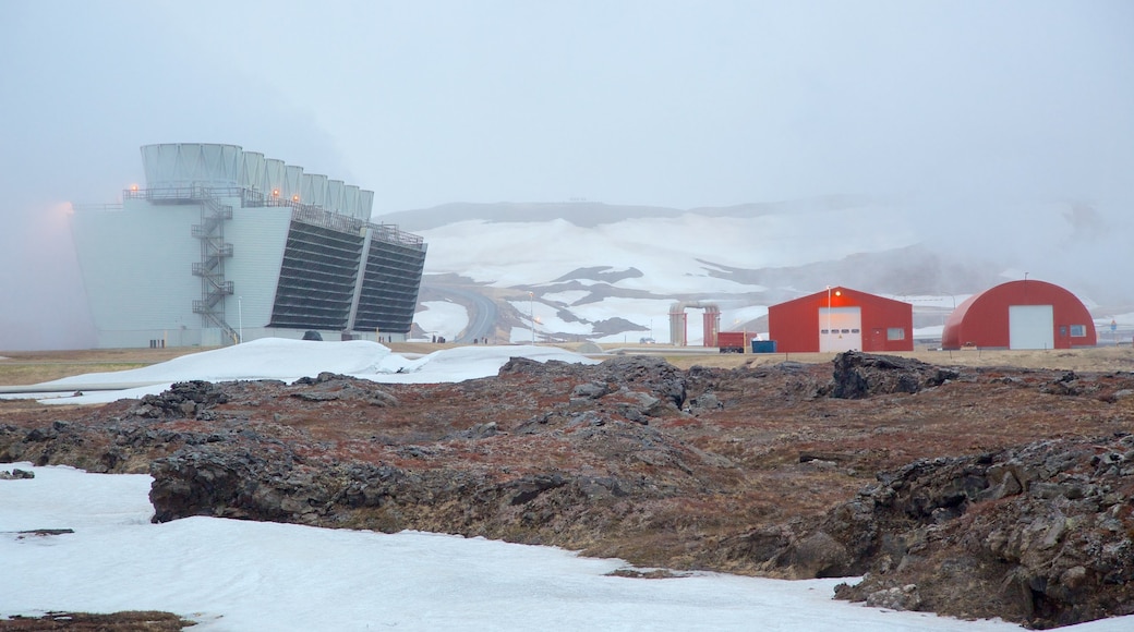 Krafla Volcano featuring mist or fog, industrial elements and snow