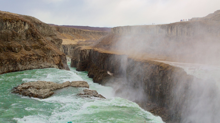 Tungufell which includes a waterfall, rapids and mist or fog