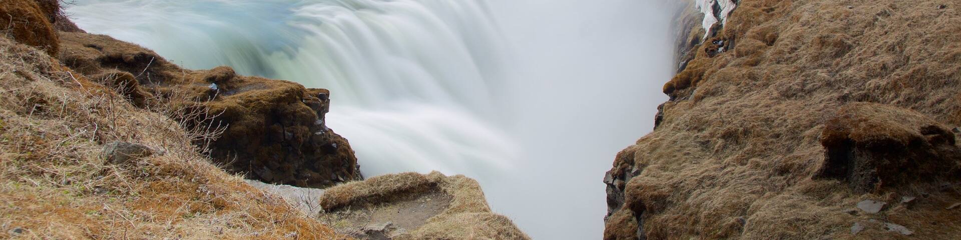 Gullfoss Waterfall which includes a cascade, a gorge or canyon and mist or fog