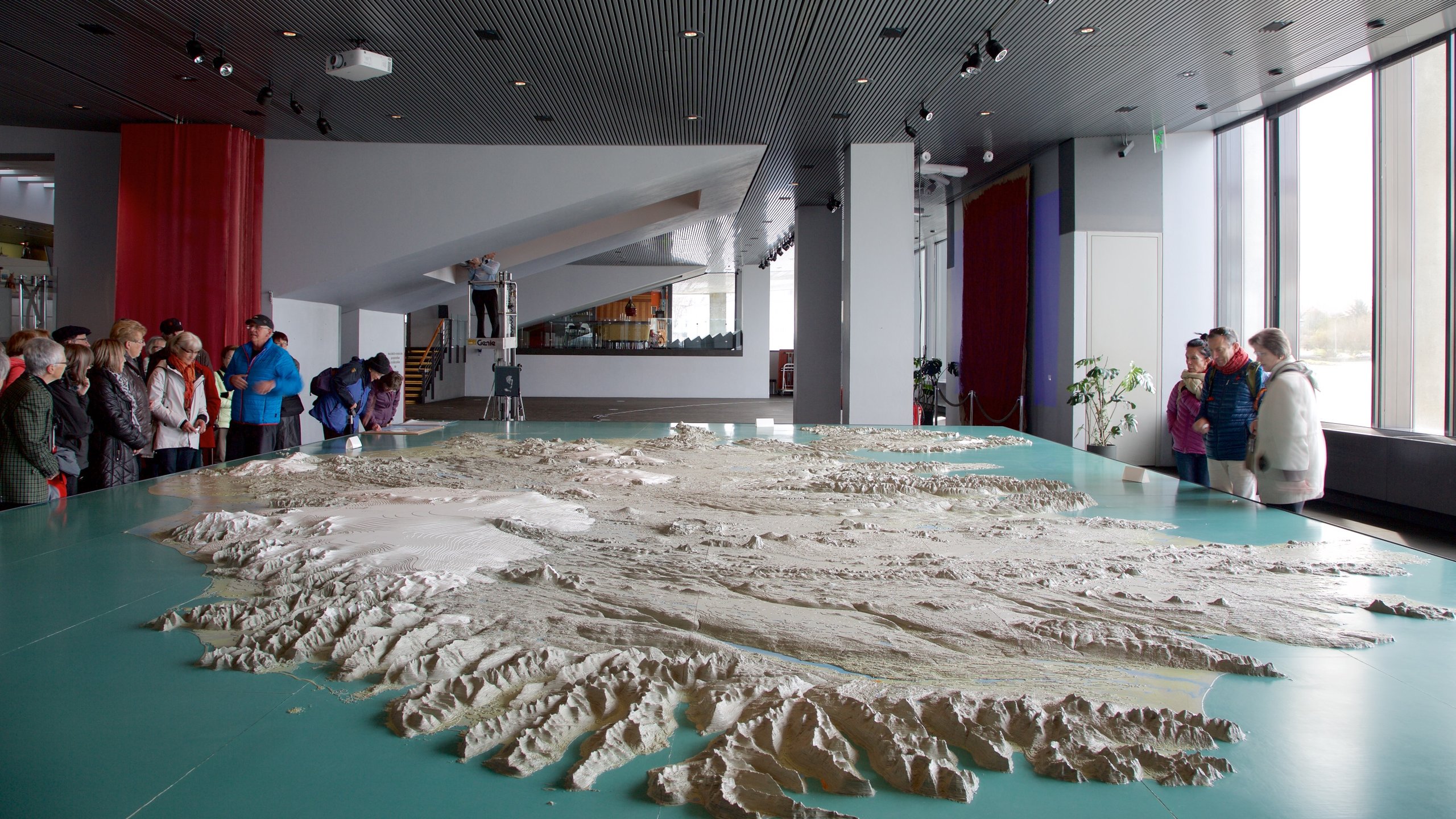 Reykjavik City Hall featuring interior views as well as a large group of people