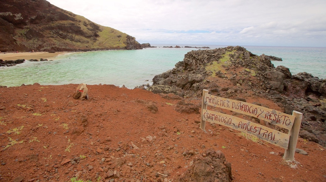 Ovahe Beach showing signage and rugged coastline