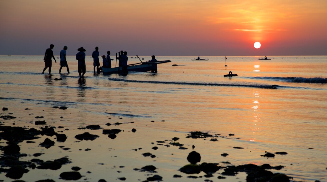 Oslob Beach showing general coastal views, a sunset and a sandy beach