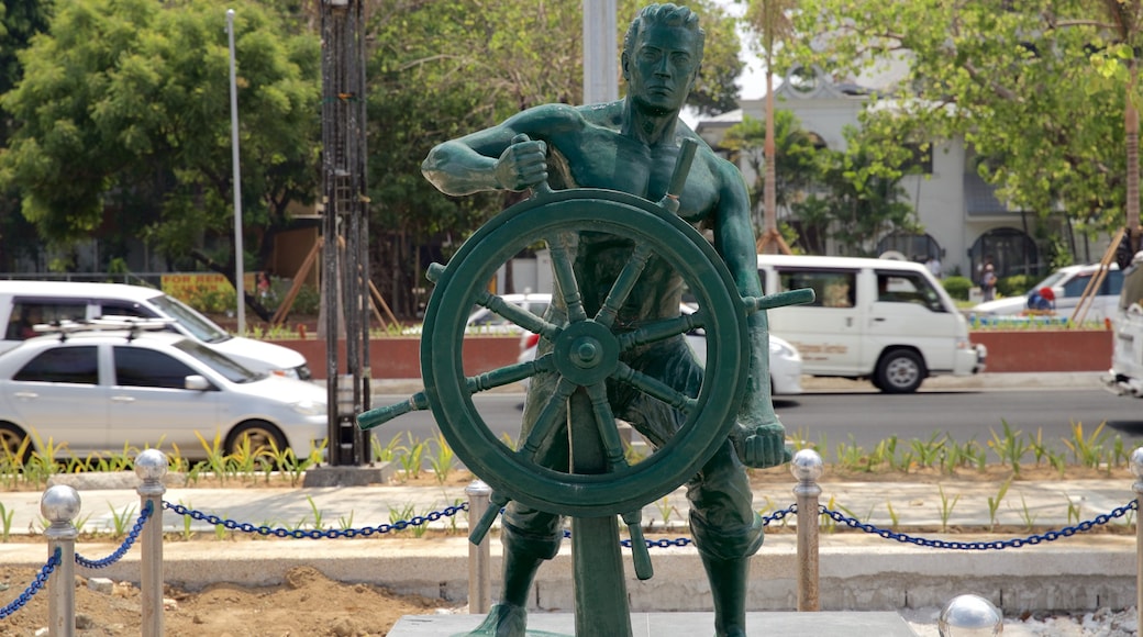 Manila Bay showing a statue or sculpture