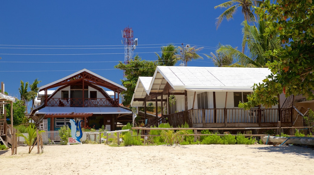 Logon showing a house and a sandy beach