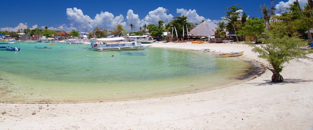 Logon que inclui paisagens litorâneas e uma praia