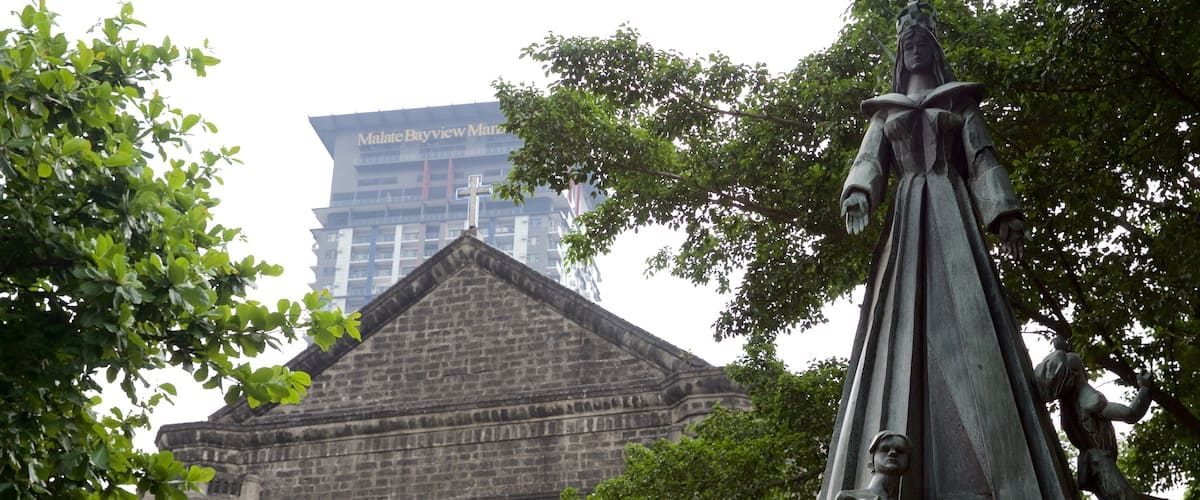 Malate which includes a statue or sculpture, religious aspects and heritage architecture