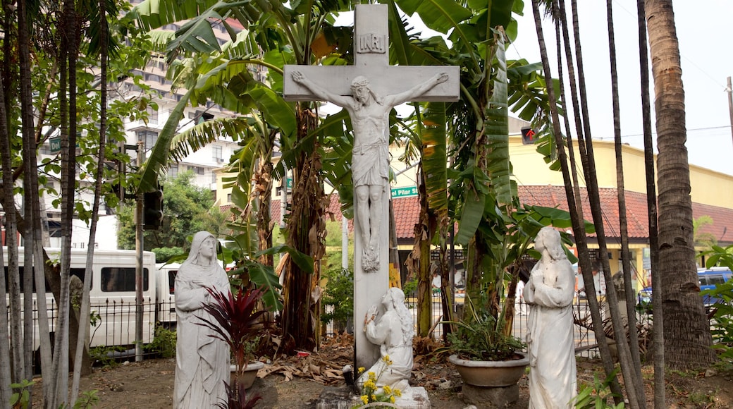 Malate which includes a statue or sculpture and religious elements