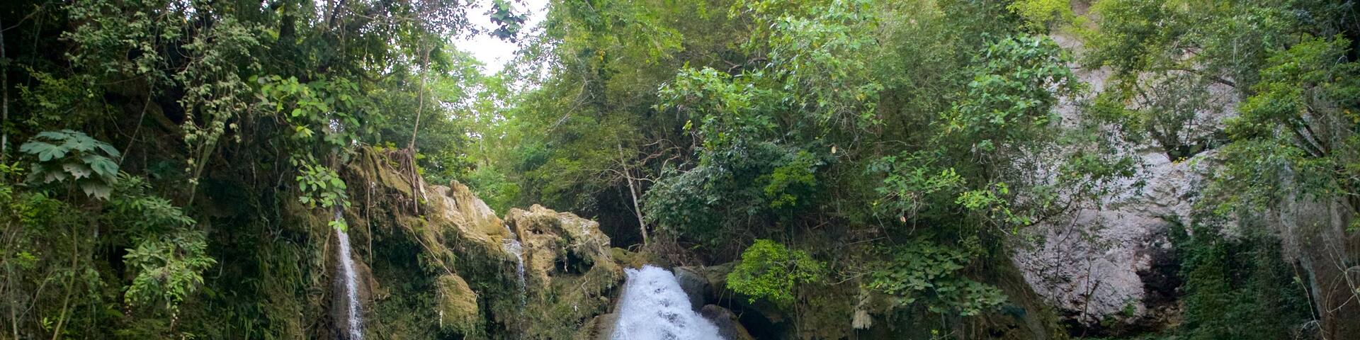 Kawasan Falls which includes a cascade as well as a small group of people