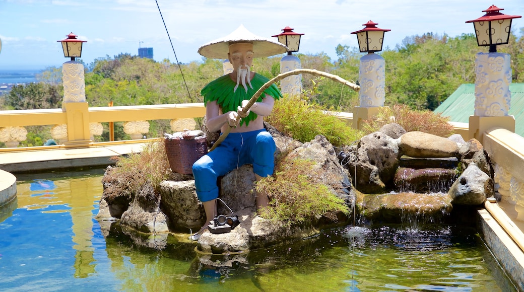 Philippines Taoist Temple showing a statue or sculpture and a pond