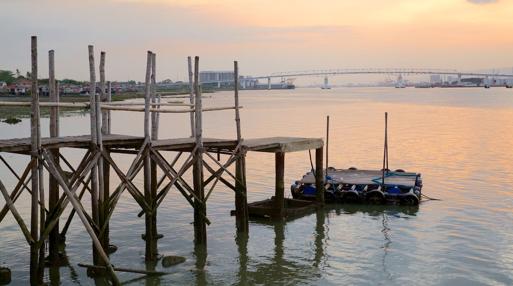 Marcelo Fernan Bridge featuring a sunset and a river or creek