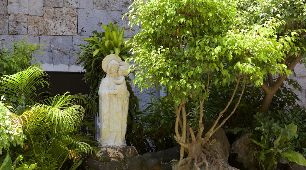 Basilica of the Holy Child featuring a park and a statue or sculpture