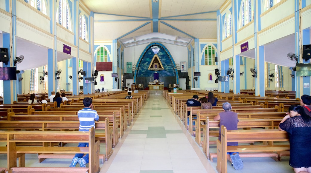 Our Lady of the Rule Church featuring religious elements, interior views and a church or cathedral