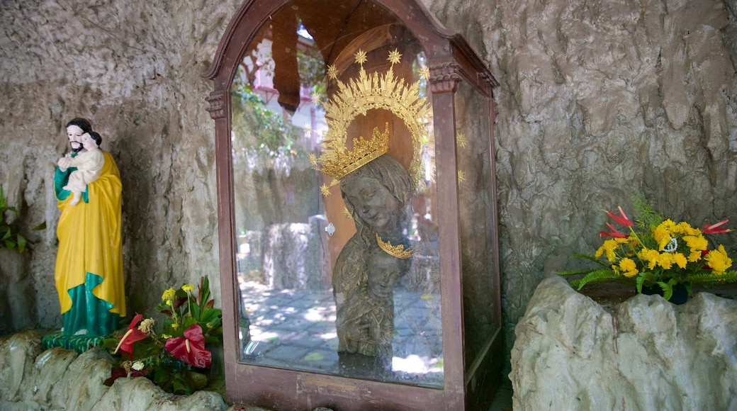 Our Lady of the Rule Church showing a statue or sculpture