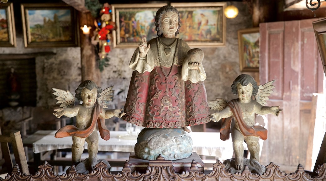 Yap Sandiego Ancestral House showing a statue or sculpture