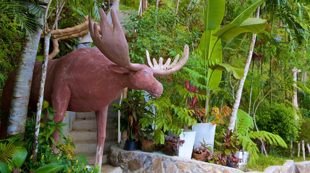 Cebu presenterar en staty eller skulptur och en trädgård