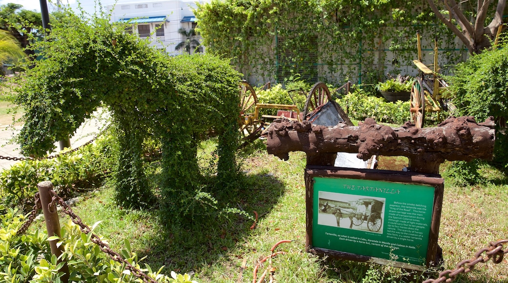 Cebu Island featuring signage and a garden