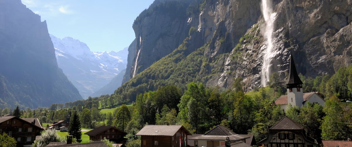 Lauterbrunnen featuring a small town or village, a gorge or canyon and a waterfall