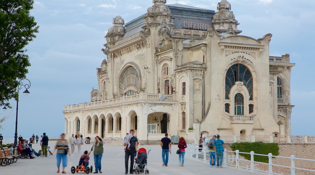 Constanta Casino featuring heritage architecture as well as a large group of people