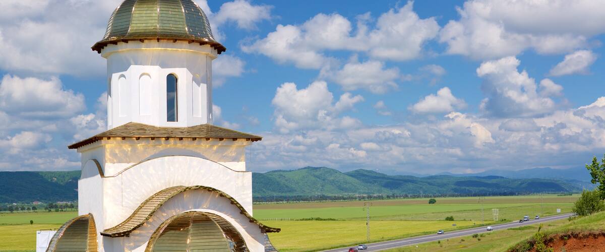 Romania showing farmland and modern architecture