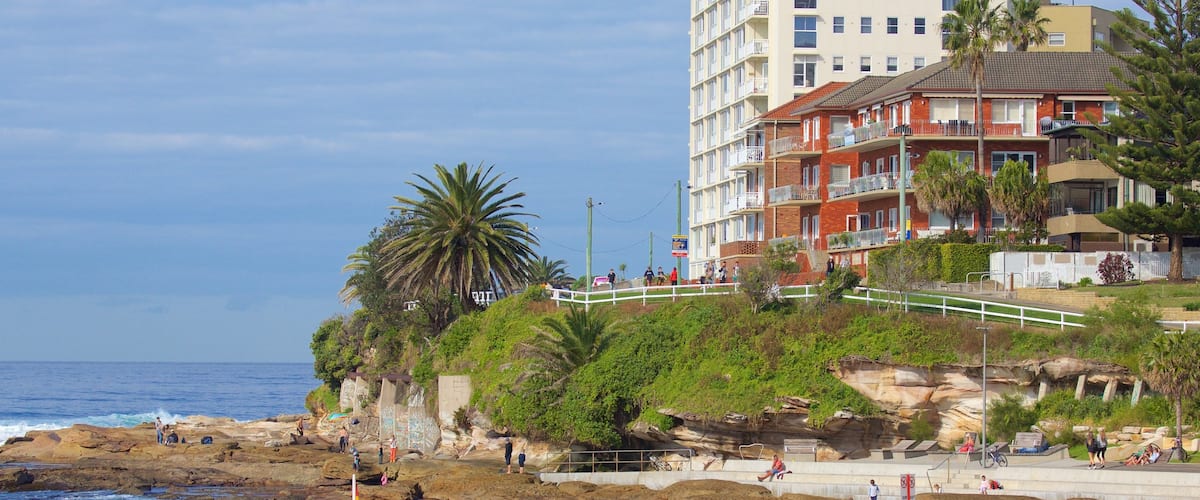 Cronulla Beach featuring rocky coastline and a beach