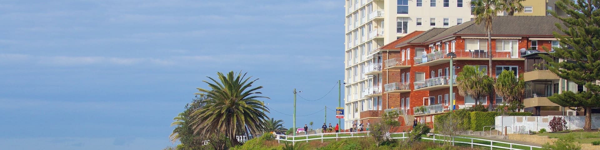 Cronulla Beach featuring rocky coastline and a beach