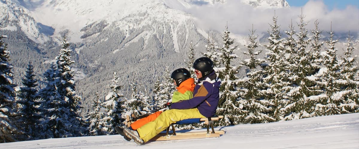 Going am Wilden Kaiser featuring snow, mountains and snow tubing