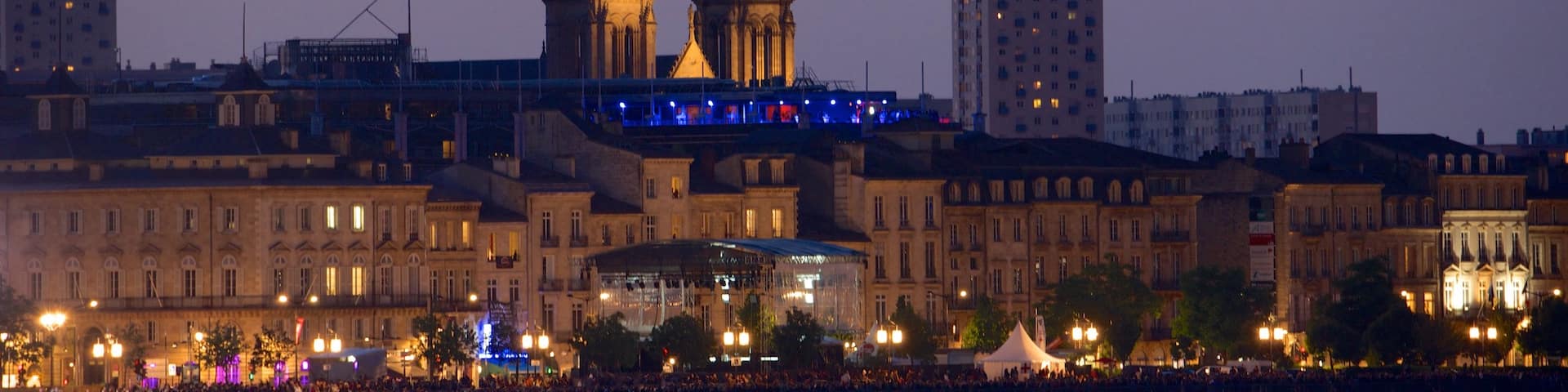 Cathedrale St. Andre showing a city, a river or creek and night scenes