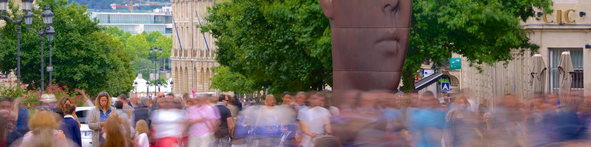 Bordeaux which includes outdoor art as well as a large group of people