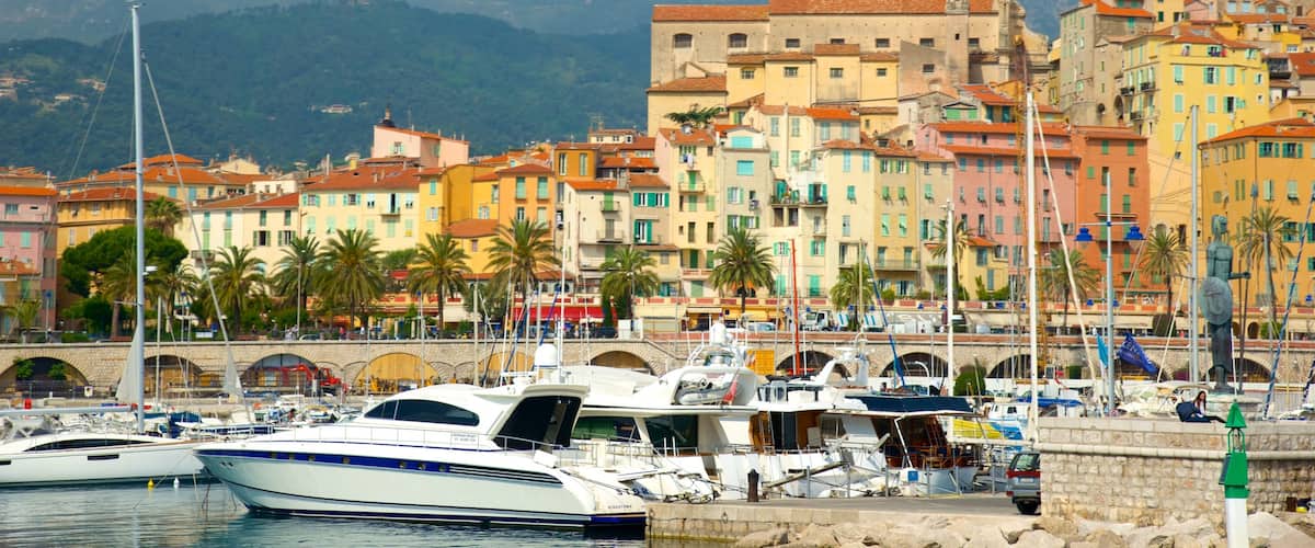 Menton featuring a marina and a coastal town