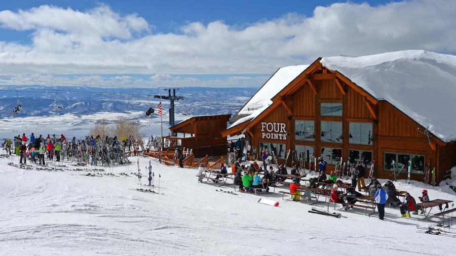 Steamboat Ski Resort which includes snow skiing and snow as well as a large group of people