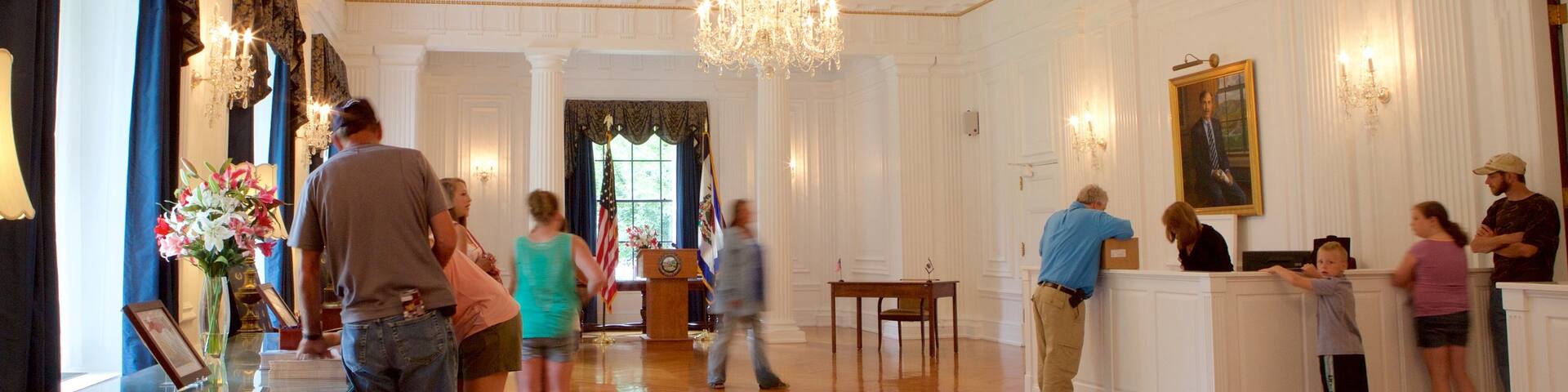 West Virginia State Capitol Building featuring interior views and an administrative building as well as a small group of people