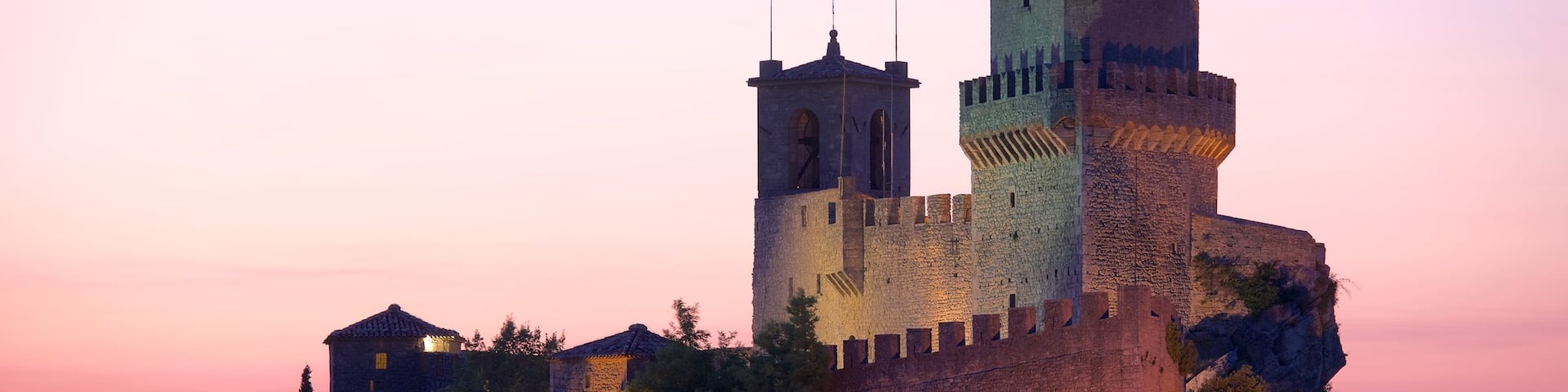 Guaita Tower showing a sunset, chateau or palace and heritage elements