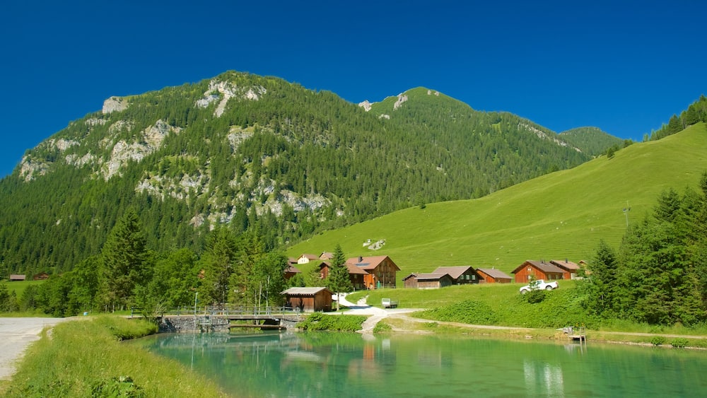 Malbun showing mountains, a river or creek and a small town or village