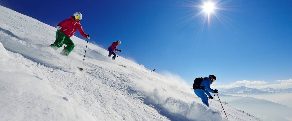Itter showing snow skiing and snow as well as a small group of people