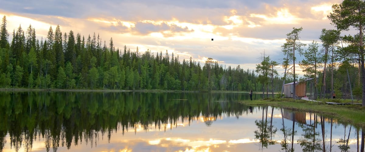 Luosto featuring a river or creek, a sunset and tranquil scenes