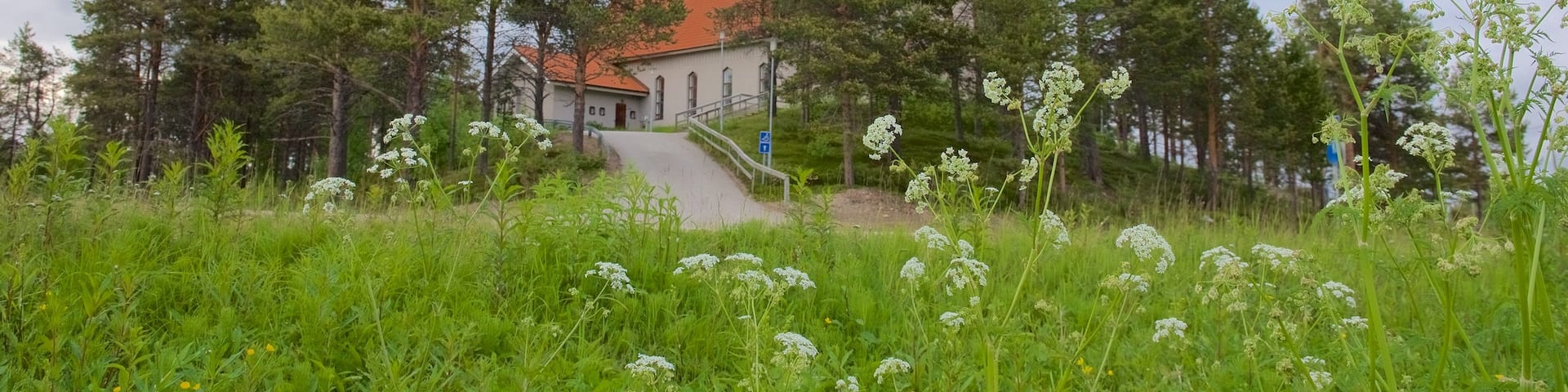 Enontekio Church which includes a park and a church or cathedral