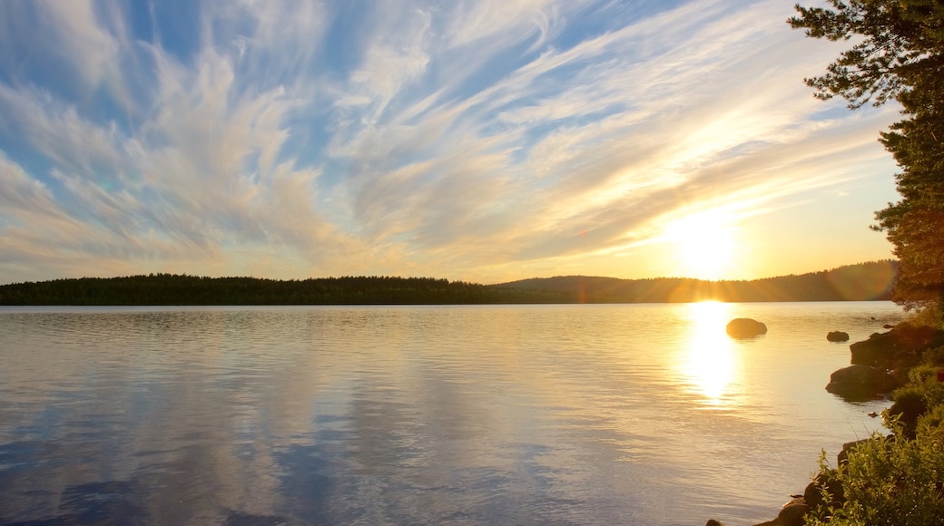 Inari featuring a sunset, landscape views and a lake or waterhole