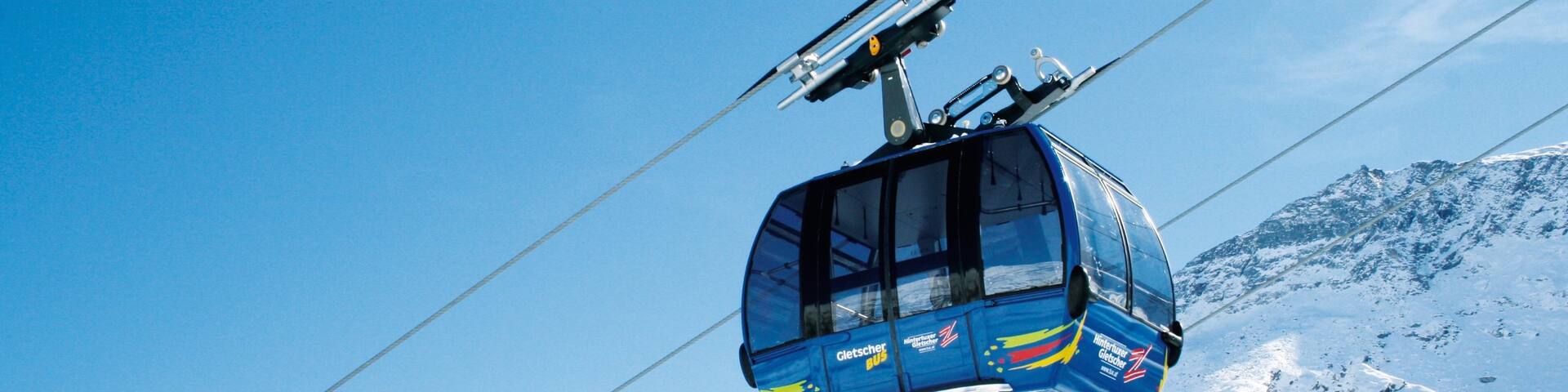 Hintertux Glacier Ski Resort showing a gondola, mountains and snow