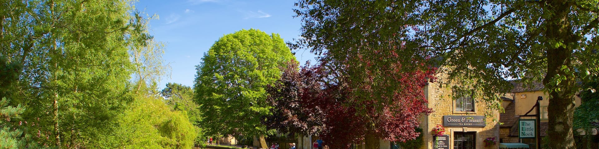 Bourton-on-Water featuring a river or creek and a garden