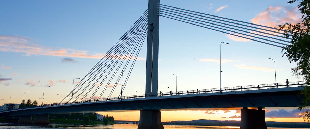 Rovaniemi showing a river or creek, a bridge and a sunset