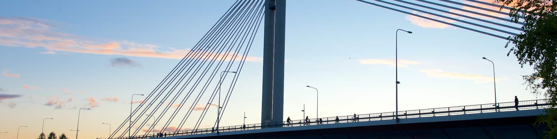 Rovaniemi which includes a sunset, a bridge and a river or creek