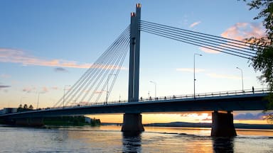 Rovaniemi showing a river or creek, a bridge and a sunset