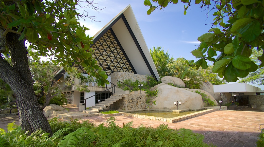 Capilla de la Paz featuring a pond and a church or cathedral