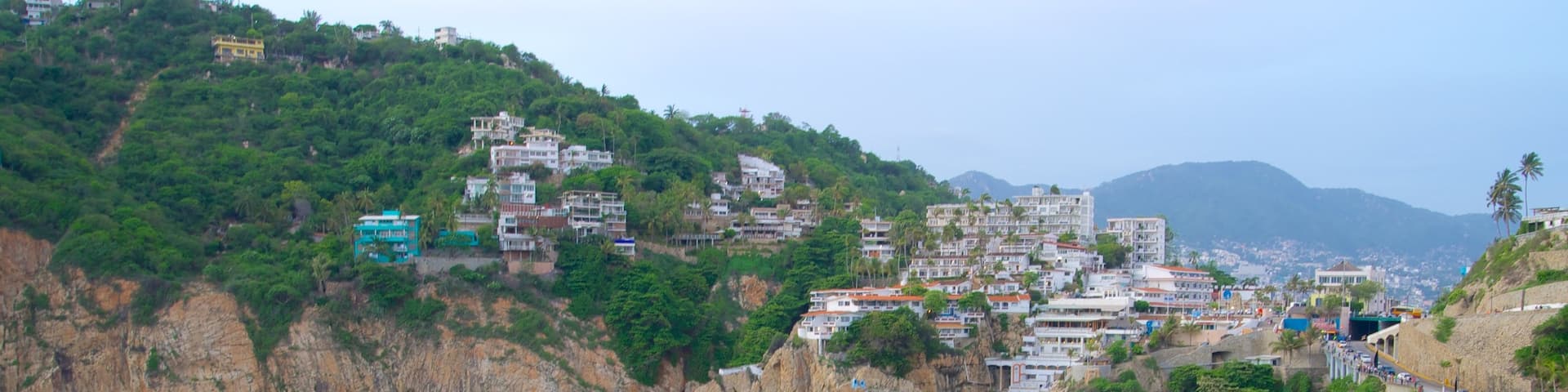 Sinfonia which includes rugged coastline, a coastal town and a gorge or canyon