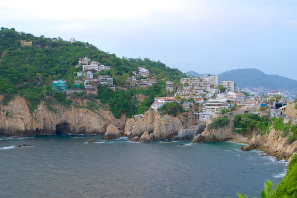 Sinfonia which includes rugged coastline, a coastal town and a gorge or canyon