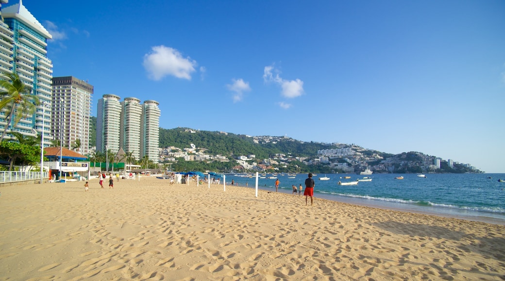 Icacos Beach which includes a beach, a coastal town and a city