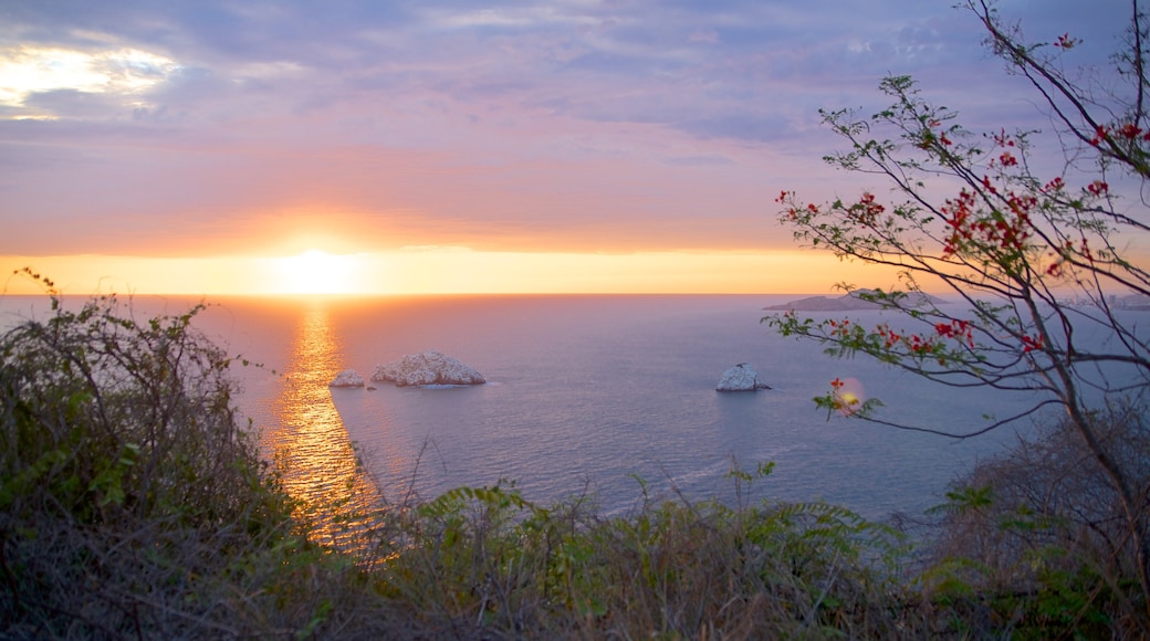 El Faro Lighthouse featuring a sunset, landscape views and views