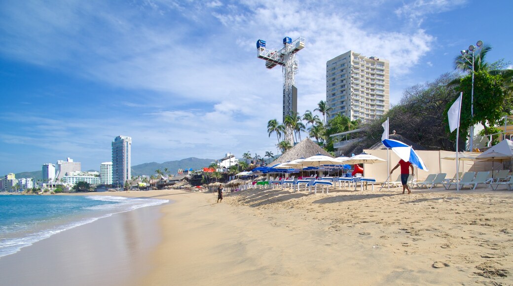 Condesa Beach which includes a coastal town and a beach