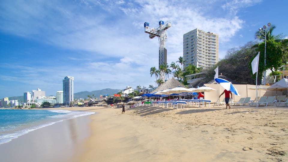 Condesa Beach showing a coastal town and a beach